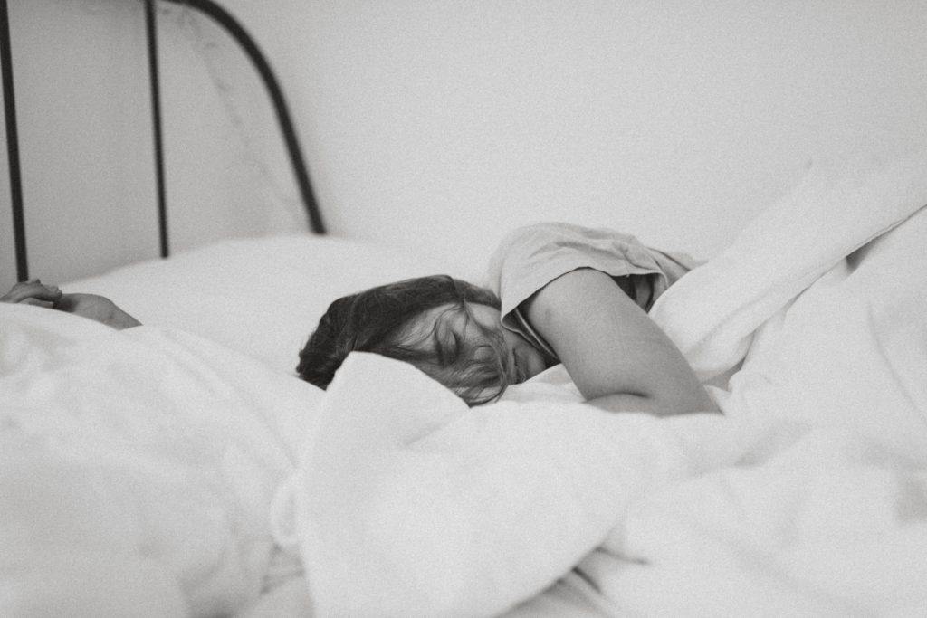 woman asleep in a bed